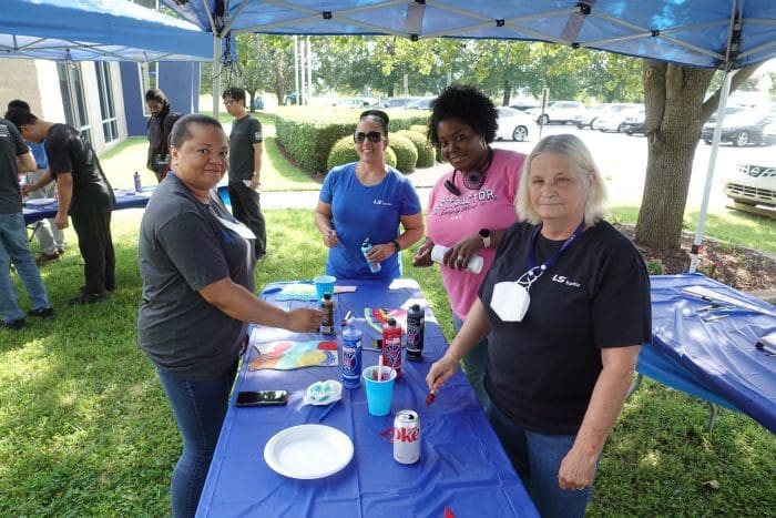 people doing crafts outside
